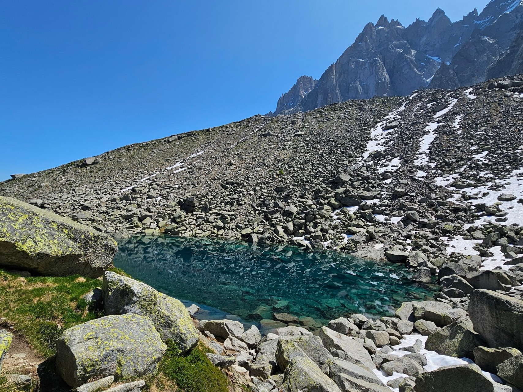 Lac Bleu (Blue Lake) is blue, but also so clear it almost blends with its glacial background.