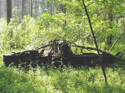 A very old (antique) abandoned hay baler near an old homestead on the banks of the Chattooga River.