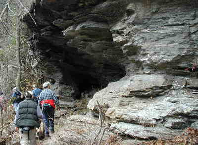 We walk past a large rock cave on the banks of the Chattooga.