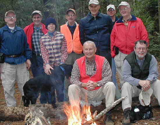 Here is the OFHC gang at lunch by the campfire. (l-r seated) Jack Jacobi and Bob Magee. (l-r standing) Tony Presley, Dan Ross, Donna Presley and "Jet" Presley, Wayne Miller, Bob Thompson, Dan Miller, and Bob Presley.