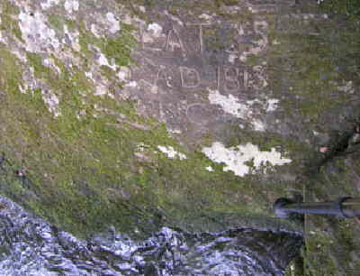 Here is the first survey mark (Commissioner's Rock). Engraved LAT 35 , A.D. 1813 , NC + SC