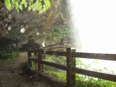 Standing behind the falls is a cool, misty experience.