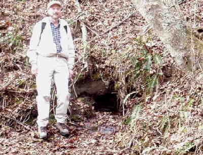At Chattahoochee Gap, Ray stands next to the spring that is the official headwaters of the Chattahoochee River.
