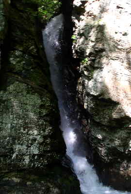 Raven Cliffs Falls flows between the split in the massive cliffs.