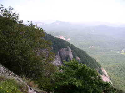 You walk along the top of the mountain with awesome views of the rock cliffs.