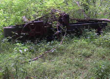 This old hay baler sits abandoned near the old homestead.