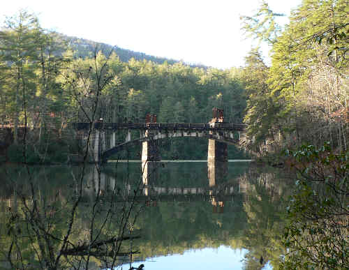 View of the Tallulah Falls Lake bridge and old railroad piers. From the Terrora Trail Lake Loop.