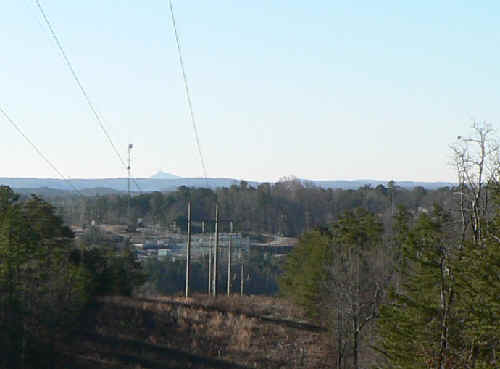 Crossing under the power lines, we can see Currahee Mountain in Toccoa.