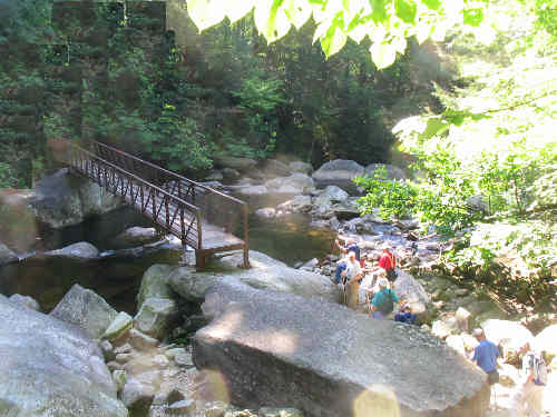 The boulder field and foot-bridge below Whitewater Falls.
