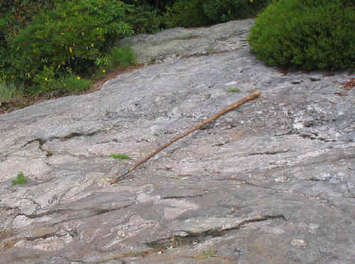 Our geologist described the rock as "Complexly contorted layers of biotite gneiss and schist"..........and I took it for granite!