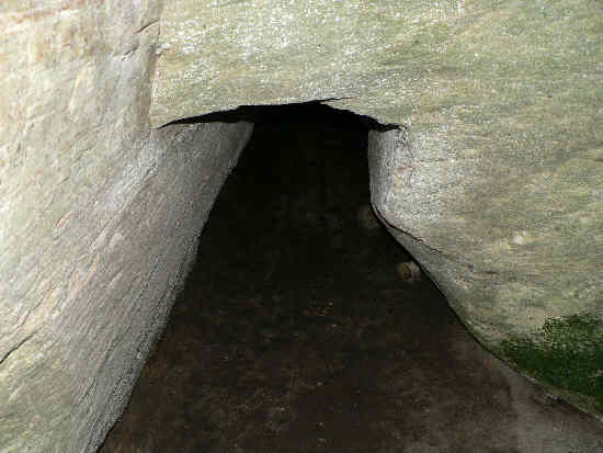 From inside, we see a second opening to a back room on the left (filled with mud and water).