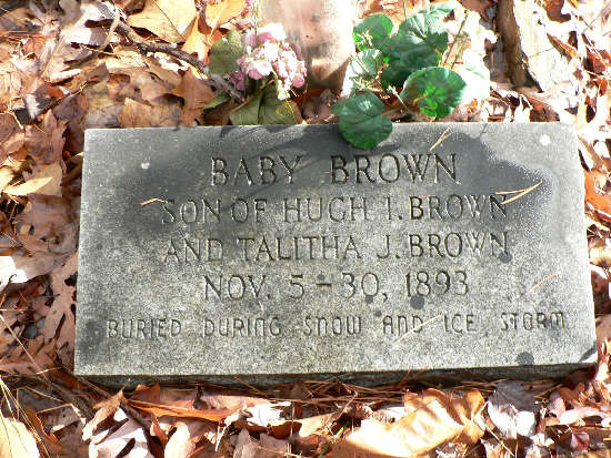 The marker for the Brown Baby who died during a snow-ice storm in November of 1893.