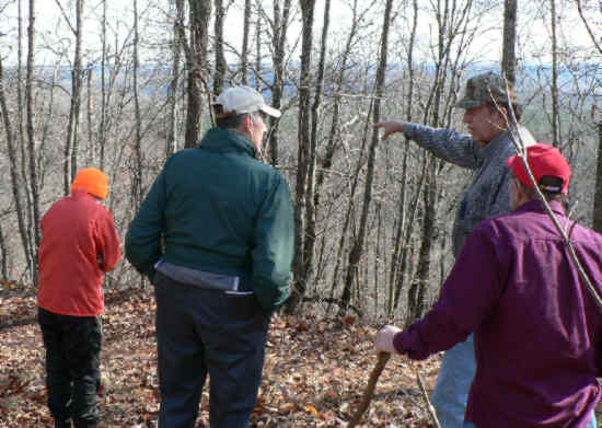 We also walked up Farmer Mountain to the Farmer-Simmons Cemetery. Here, Howard Farmer points out some features of interest.