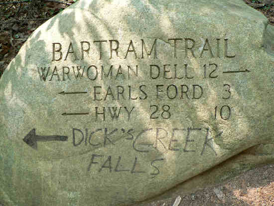 Trail marker rock at Sandy Ford Road.
