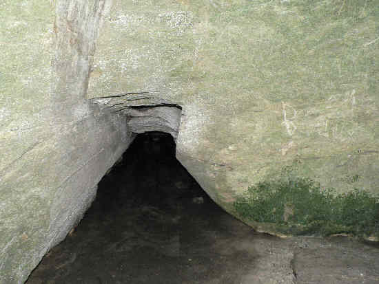 This photo was taken inside the den and it shows an entrance to a back room.