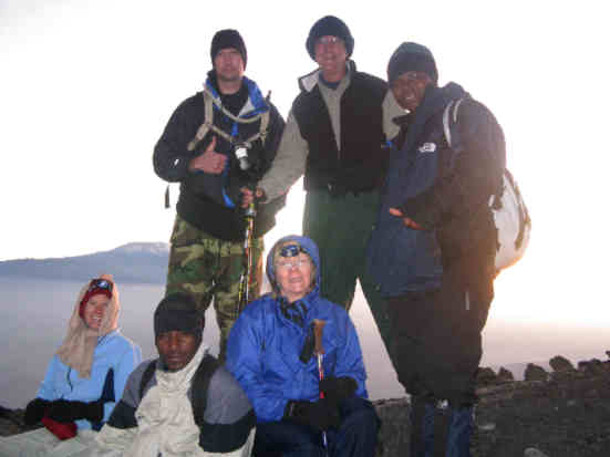 Sunrise at high point of the hike where altitude sickness was starting to set in. 13,782 feet (4,200 meters) The Millers along with guides Isaack, and Good Luck!