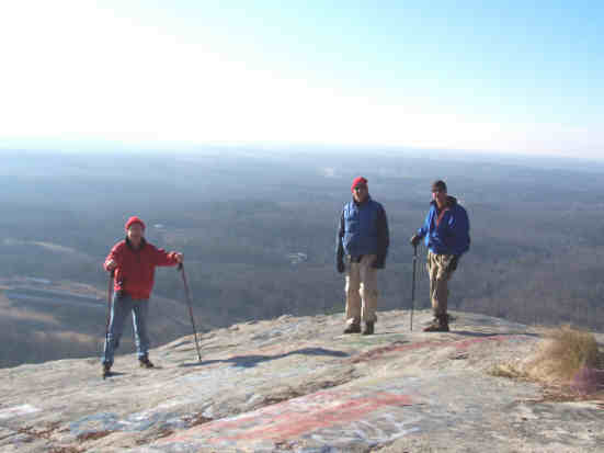 From the rock cliffs at the summit, we enjoy awesome views. .