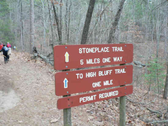 The trail-head at the upper end of the parking lot.