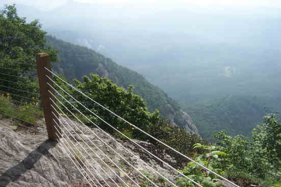 Awesome rock cliffs with protective cable fencing.
