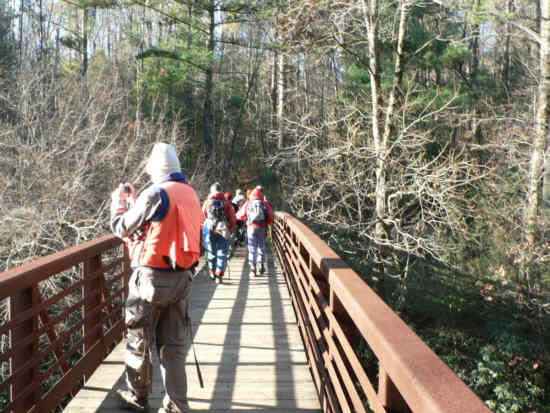 Crossing the iron bridge across the West Fork Chattooga River.