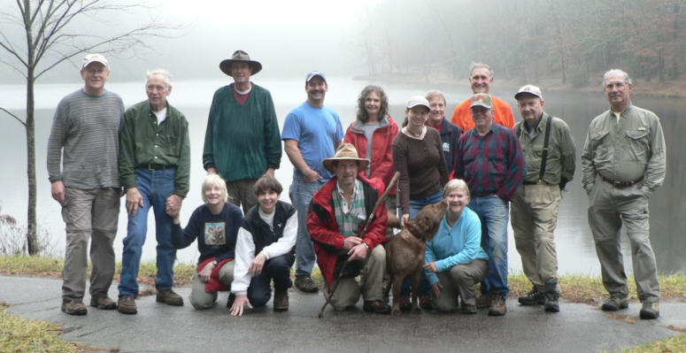 The damp OFHC gang for today's hike. (kneeling l-r) Geri Whitaker, Donna Presley, Bruce O'Connor, "Bo" the trail dog and Faye Sisson, (standing l-r) Tony Presley, David Whitaker, Pom Sinnock, Jeff Anderson, Carole Wintle, Melissa Anderson, Jeanne O'Connor, Vic Robson, Dan Ross, Doug Russell and Bill Hunt.