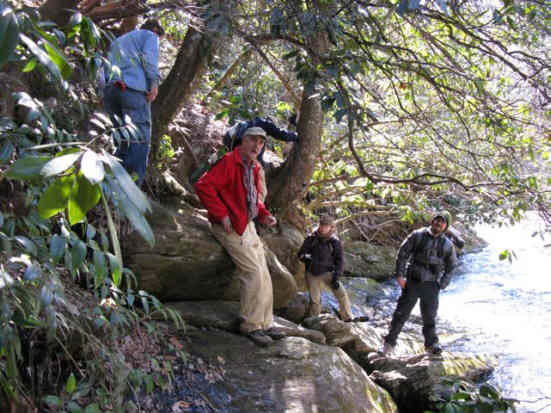 You have to scramble down a slippery slope to view the rock engravings.