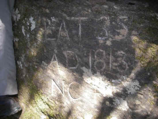 Here is the first survey mark (Commissioner's Rock). Engraved LAT 35 , A.D. 1813 , NC + SC
