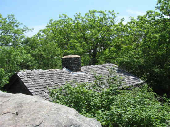 Standing on the rocks at the summit looking down to the Blood Mountain Trail Shelter.