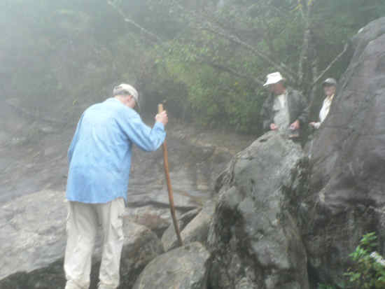 Exploring the wet rocks on the river.