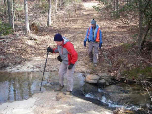 Crossing the creek carefully. You do not want to get your feet wet today!
