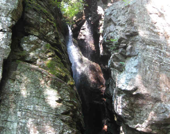 Raven Cliffs Falls in the split of the massive rock cliffs.