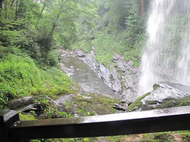 Looking from behind the falls down to the Cullasaja Gorge below.