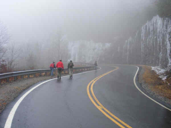 Headed up the highway toward the rock cliffs.