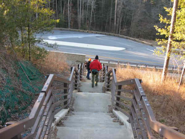 Headed down the stairs to the bridge across the river.