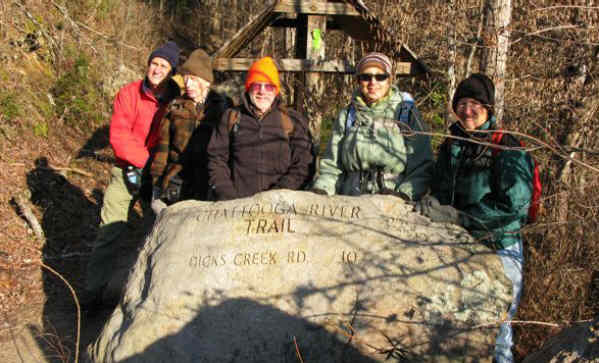 The large engraved boulder at the start.