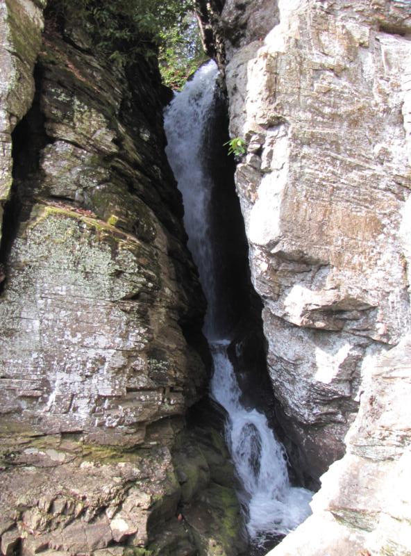 Raven Cliffs Falls runs between the split in the rock cliffs.