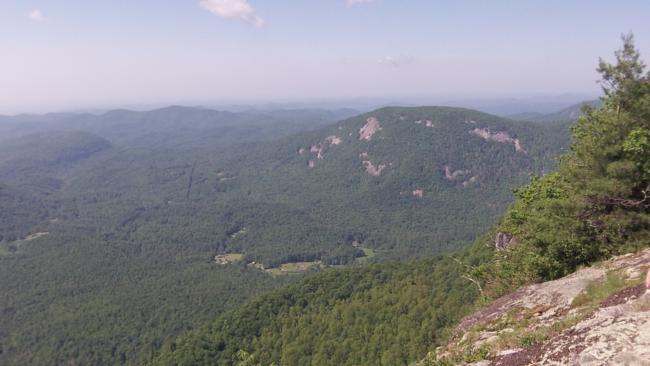 The trail brings you across the rim of spectacular rock cliffs.
