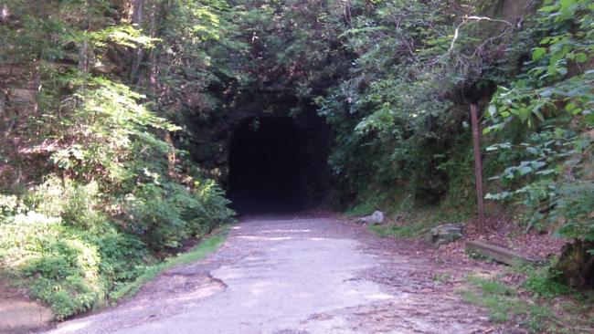 As we approach the opening of the tunnel, we feel refreshing cool air coming from inside.