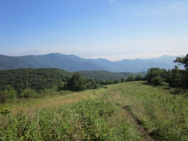 Headed down the grassy slope with awesome views!