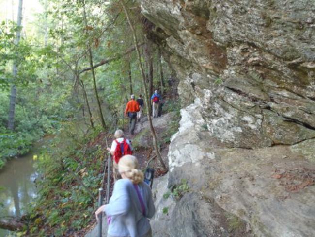 Walking along the rock cliffs above the creek.