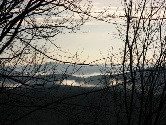 Early morning mountain views show dense fog in the valleys.