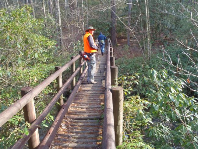 Crossing the foot-bridge across the East Fork of the Chattooga..
