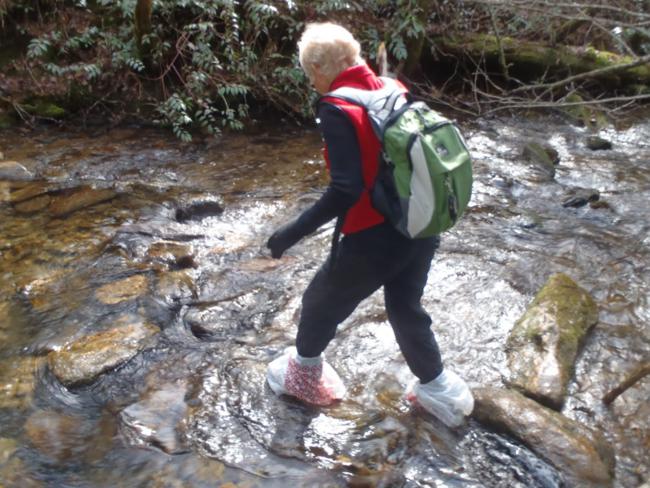 Crossing Bad Creek is very slippery and plastic bags come in handy.
