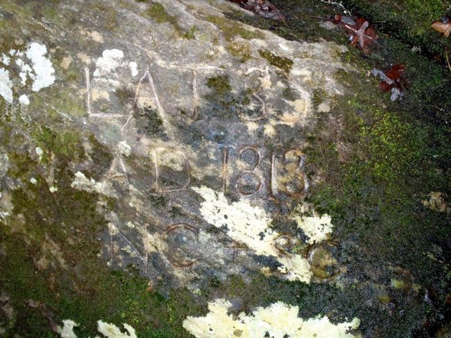 This is the rock engraved by the commissioners in 1813. Most folks never find these to rocks due to the treacherous slope on the edge of the rapids.