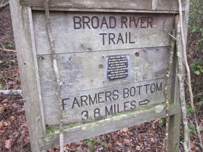 Trail sign near the road.