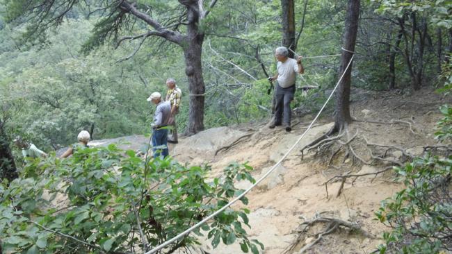 Big Rock is a steep lookoff into the valley below. The rope allows a safer walk down to the rock.
