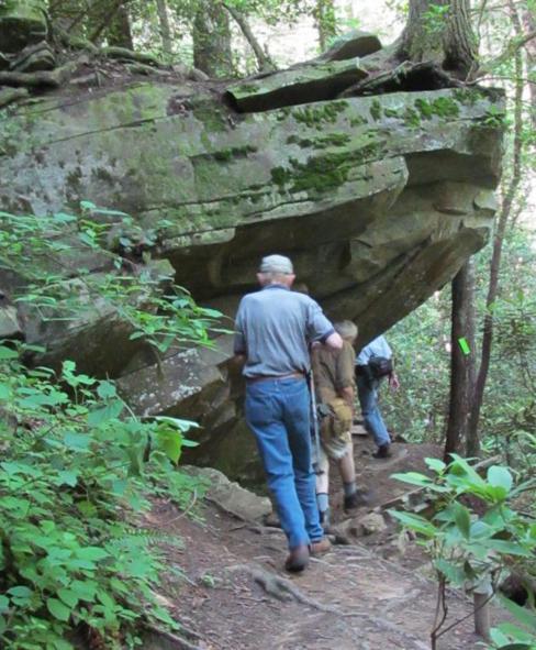 The trail passes under this rock outcrop.