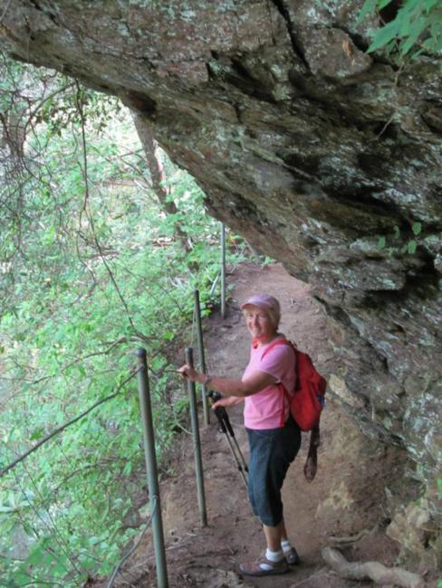 Getting closer to the falls, the trail passes along rock cliffs well above the creek.