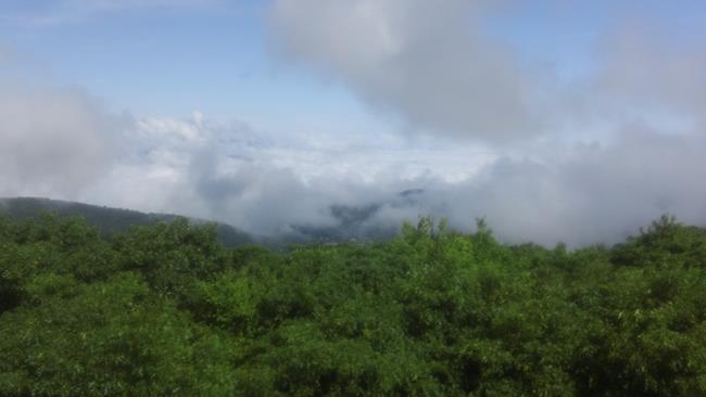 Lots of blue sky above but low hanging clouds blocked some of the mountain views.