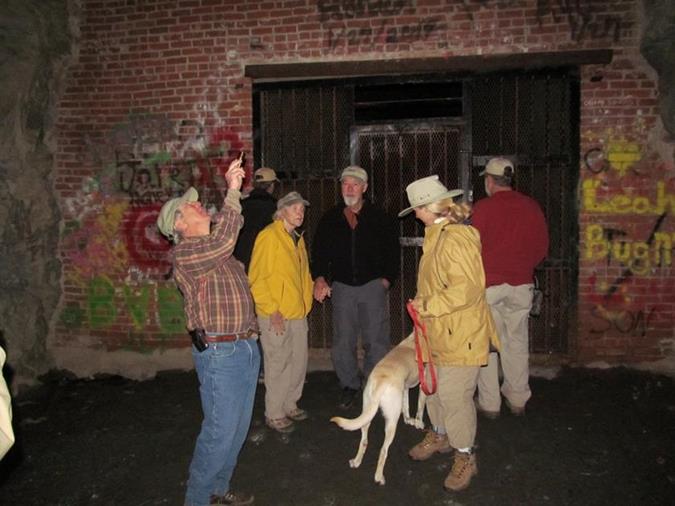 The brick wall was built for the Clemson University cheese aging area back in the early 1950's. The tunnel is gated and locked at this point.